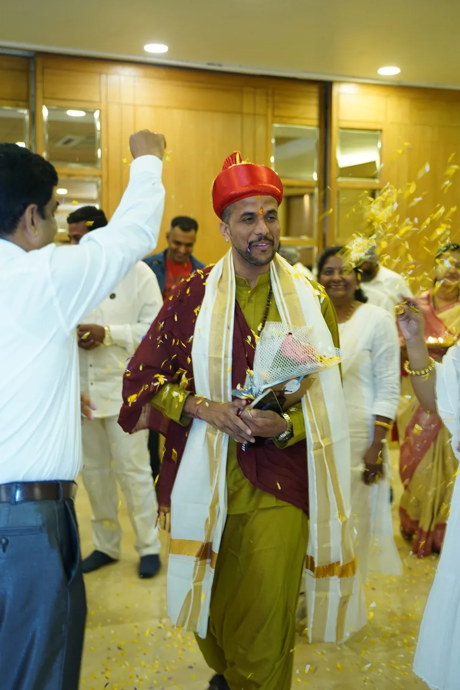 Ashishh L Vyas being welcomed with a turban and shawl at an event